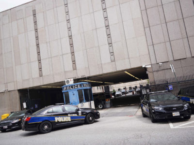 Police cars are seen outside of the Baltimore City Police Headquarters in Baltimore, Maryland, on August 8, 2017.