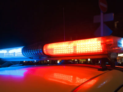 Red light flasher atop of a police car.