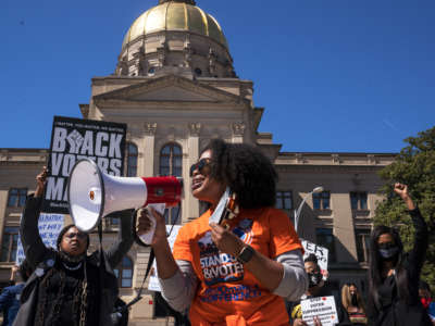 Demonstrators protest outside of the state capitol building in opposition of House Bill 531 on March 8, 2021, in Atlanta, Georgia.