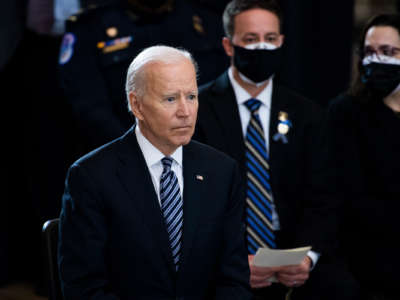 President Joseph Robinette Biden looks onward during a memorial service
