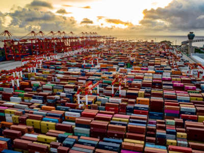 An aerial photo taken on September 11, 2021, shows large container ships loading and unloading cargo at Yangshan Deep-water Port in Shanghai, China.