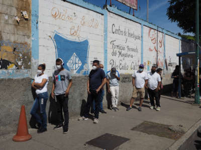 Voters wait to vote at the Liceo Pedro Emilio Coll in the Coche Parish in Caracas Venezuela during elections on November 21, 2021.
