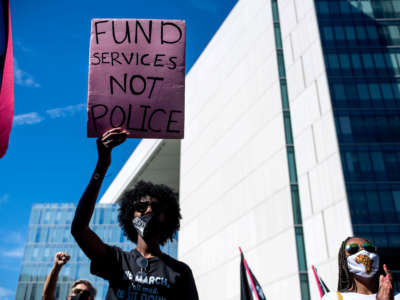 Demonstrators join a Black Lives Matter rally outside LAPD Headquarters in Los Angeles, California, during the first anniversary of George Floyd's death on May 25, 2021.