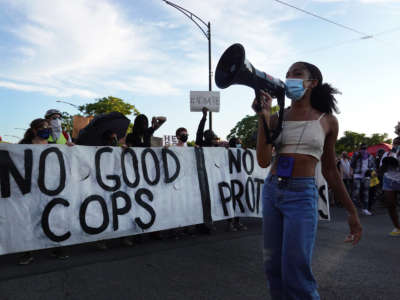 Activists march through the Lawndale neighborhood calling for the defunding of police on July 24, 2020, in Chicago, Illinois.
