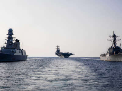 The guided missile destroyer USS Delbert D. Black, right, the aircraft carrier USS George H.W. Bush, center, and Italian Navy destroyer ITS Caio Duilio sail in formation in the Adriatic Sea on February 24, 2023.