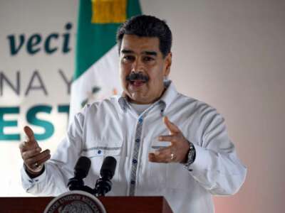 Venezuelan President Nicolas Maduro speaks at a podium