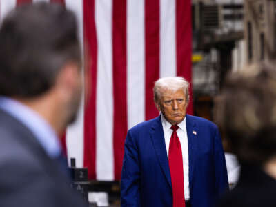 Trump walks around backstage