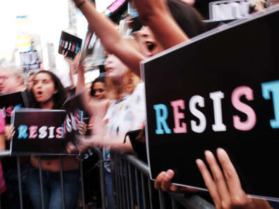 Dozens of protesters gather in Times Square near a military recruitment center to show their anger at President Donald Trump's decision to reinstate a ban on transgender individuals serving in the military on July 26, 2017, in New York City.