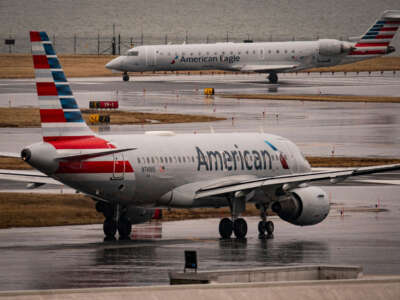 An American Eagle and American Airlines plane taxi on the runway at Ronald Reagan Washington National Airport, on February 6, 2025, in Arlington, Virginia.