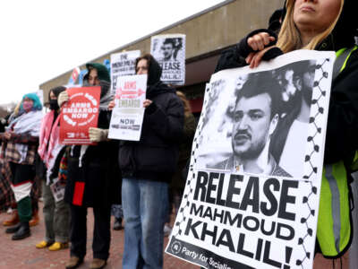 Protesters hold signs demanding the release of Mahmoud Khalil in Boston, Massachusetts, on March 30, 2025.