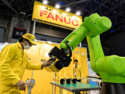 A robotic arm made by FANUC group is demonstrated during the World Robot Expo held as part of the World Robot Summit on October 17, 2018, in Tokyo, Japan.