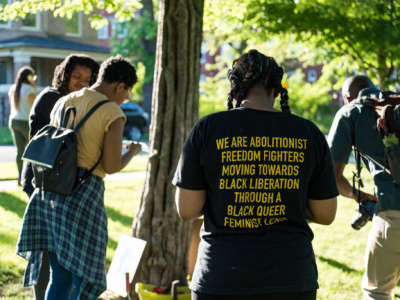 Participants take part in an event organized by Love & Protect to lift up the names and celebrate the lives of Black women and girls who have been killed by state violence at Rekia's Tree in Douglass Park, Chicago, on June 13, 2018.