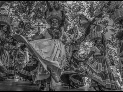 Dancers from Las Azucenas de Maria perform Jarabes from Oaxaca's central valleys on the stage in the plaza.