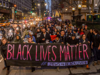 Over a hundred people joined Ramarley Graham's family and other organizations and groups for a public action and vigil in conjunction with Beyond The Moments National Day of Action on April 4, 2017.