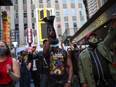 Protesters take to the streets to mark May Day in New York City on May 1, 2021.