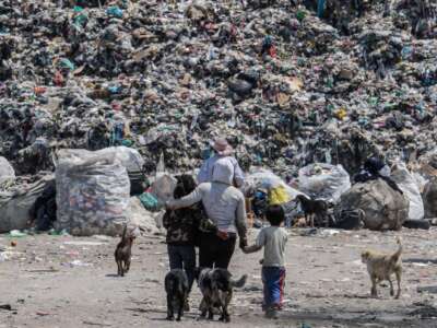 People during the collection and separation of waste that arrives daily at the largest garbage dump in Mexico Bordo de Xochiaca, on August 31, 2021, in Mexico City, Mexico.