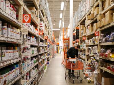 A shopper places items in a cart at a home improvement store in Bethesda, Maryland, on February 17, 2022.