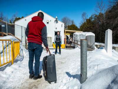 Marcello, who is Haitian and came via Mexico, then the United States, arrives at the Roxham Road border crossing in Roxham, Quebec, on March 3, 2023.