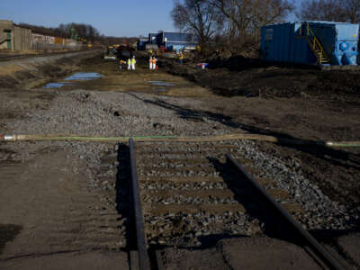 Ohio and EPA contractors collect soil and air samples from the derailment site on March 9, 2023, in East Palestine, Ohio.