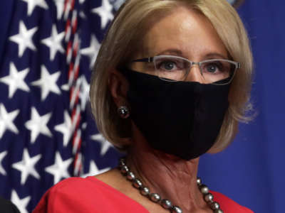 Secretary of Education Betsy DeVos listens during a White House Coronavirus Task Force press briefing at the U.S. Department of Education on July 8, 2020, in Washington, D.C.