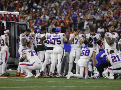 Buffalo Bills players react after teammate Damar Hamlin went into cardiac arrest during the first quarter of a game against the Cincinnati Bengals at Paycor Stadium on January 2, 2023 in Cincinnati, Ohio.