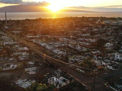 In an aerial view, burned structures and cars are seen two months after a devastating wildfire on October 9, 2023, in Lahaina, Hawaii.