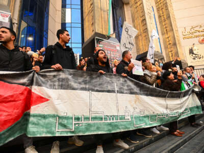 Egyptians participate in a protest in front of the Journalists Syndicate and break their fast with bread and water in protest against the starvation of the people of Gaza on March 26, 2024, in Cairo, Egypt.