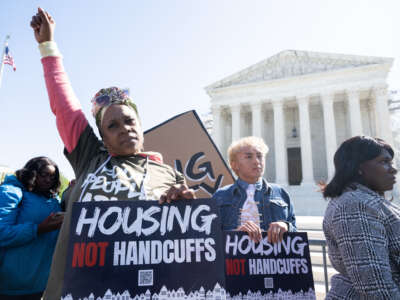 Demonstrators protest outside the U.S. Supreme Court in support of unhoused people as the Court hears the case of City of Grants Pass v. Johnson, in Washington, D.C., on April 22, 2024.