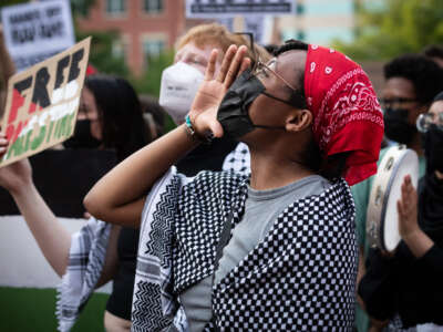 Demonstrators chant slogans at a rally at the George Washington University Gaza solidarity encampment in Washington, D.C., on May 7, 2024.
