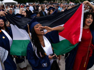 Students protest as they walk out from the George Washington University (GWU) commencement ceremony as GWU President Ellen Granberg speaks on the National Mall on May 19, 2024, in Washington, D.C.