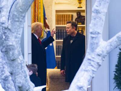 Donald Trump speaks to Elon Musk before departing the White House on his way to his home in Mar-a-Lago in Florida on March 14, 2025.
