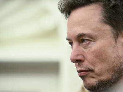 Elon Musk looks on as Donald Trump meets with South African President Cyril Ramaphosa in the Oval Office of the White House in Washington, D.C., on May 21, 2025.