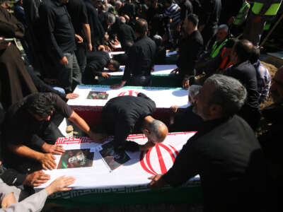 Mourners gather around the coffins of people killed in Israeli attacks in Khorramabad, Iran, during their funeral in on June 16, 2025.