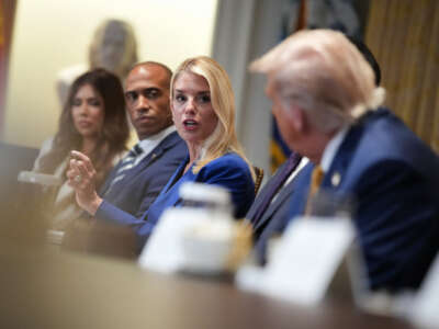 President Donald Trump listens as Attorney General Pam Bondi speaks during a Cabinet Meeting at the White House on July 8, 2025, in Washington, D.C.