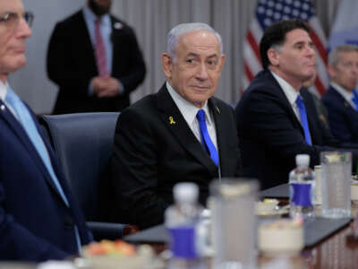 Israeli Prime Minister Benjamin Netanyahu (C) is joined by Israeli ambassador to the U.S. Yechiel "Michael" Leiter (L) and Minister of Strategic Affairs Ron Dermer and other officials for a meeting with U.S. Secretary of Defense Pete Hegseth at the Pentagon on July 9, 2025, in Arlington, Virginia.