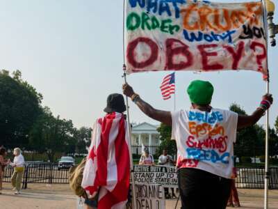 Protesters demonstrate against Donald Trump's use of National Guard soldiers and federal agents to police Washington, D.C., on September 6, 2025.