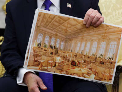 U.S. President Donald Trump displays a rendering of his proposed $250 million White House ballroom as he meets with NATO Secretary General Mark Rutte in the Oval Office of the White House on October 22, 2025, in Washington, D.C.