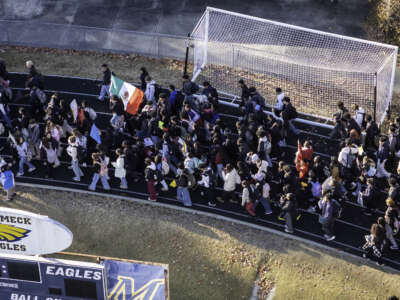 Students stage a walkout at East Mecklenburg High School in protest of U.S. Border Patrol operations targeting undocumented immigrants on November 18, 2025, in Charlotte, North Carolina.