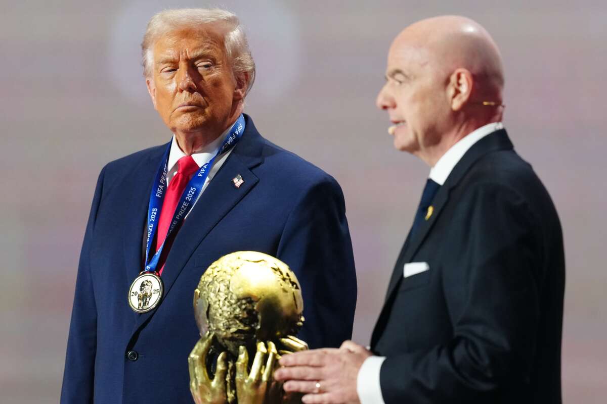 Donald Trump receives the FIFA Peace Prize from Gianni Infantino, president of FIFA, during the FIFA World Cup 2026 Official Draw at John F. Kennedy Center for the Performing Arts in Washington, D.C., on December 5, 2025.