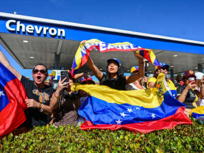 People react to the news of the US's capture of Venezuelan President Nicolas Maduro, in Doral, Florida, on January 3, 2026.