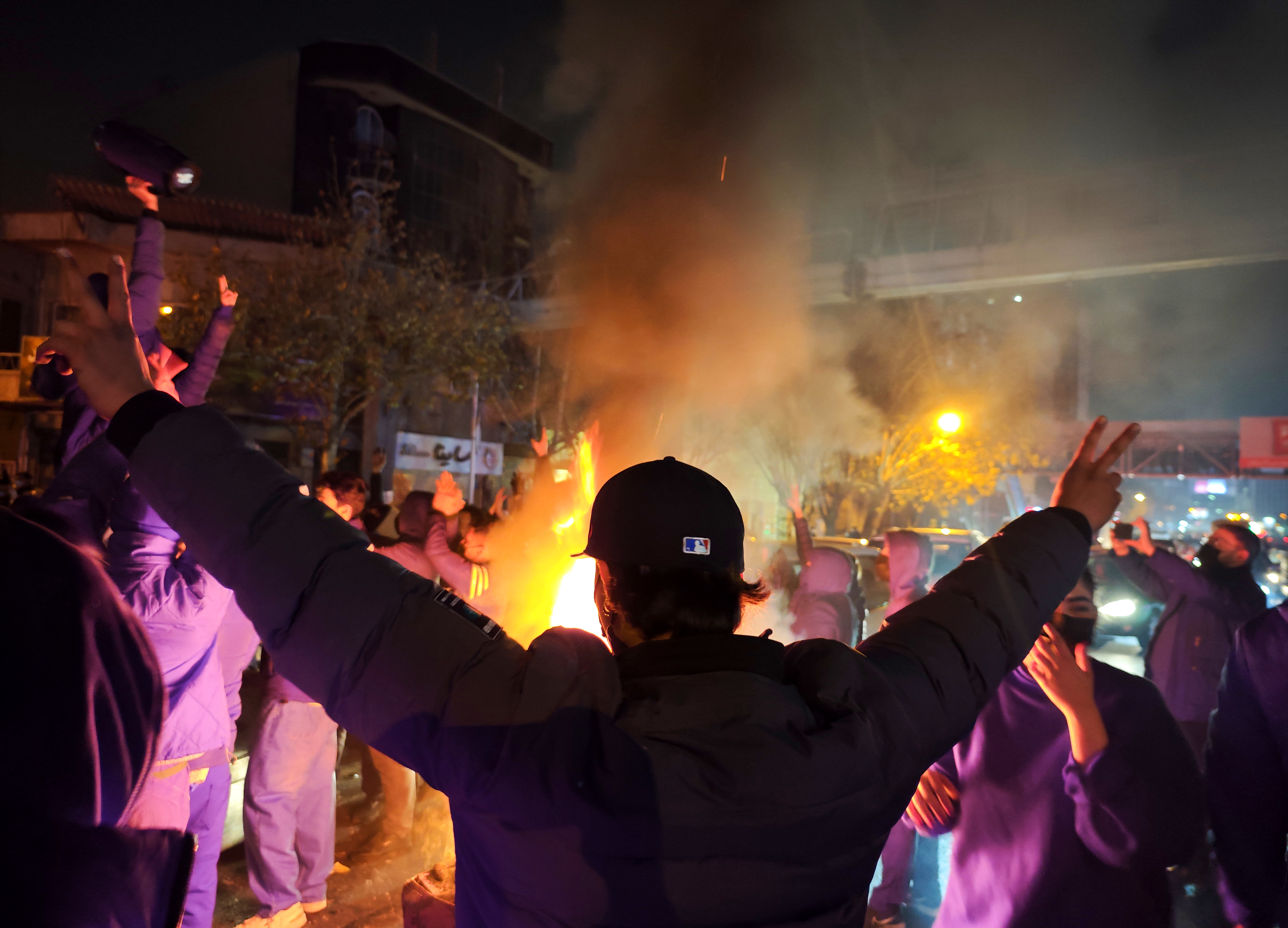 Fires are lit as protesters rally on January 8, 2026, in Tehran, Iran.