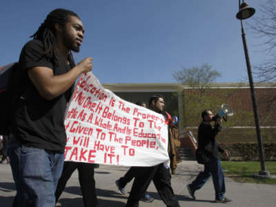 Ljazz Brooks, a third-year international business student, walks with other students in protest at California State University Los Angeles (CSULA) on February 25, 2014. He is part of the CSULA Ethnic Studies Coalition, a collective of students, educators, workers and activists demanding that at least one of the two diversity courses required to graduate from CSULA come from ethnic studies.