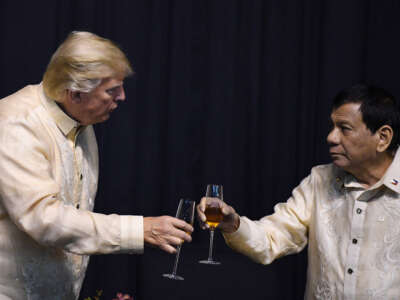 Then-Philippine President Rodrigo Duterte toasts U.S. President Donald Trump during a special gala celebration dinner for the Association of Southeast Asian Nations in Manila on November 12, 2017.
