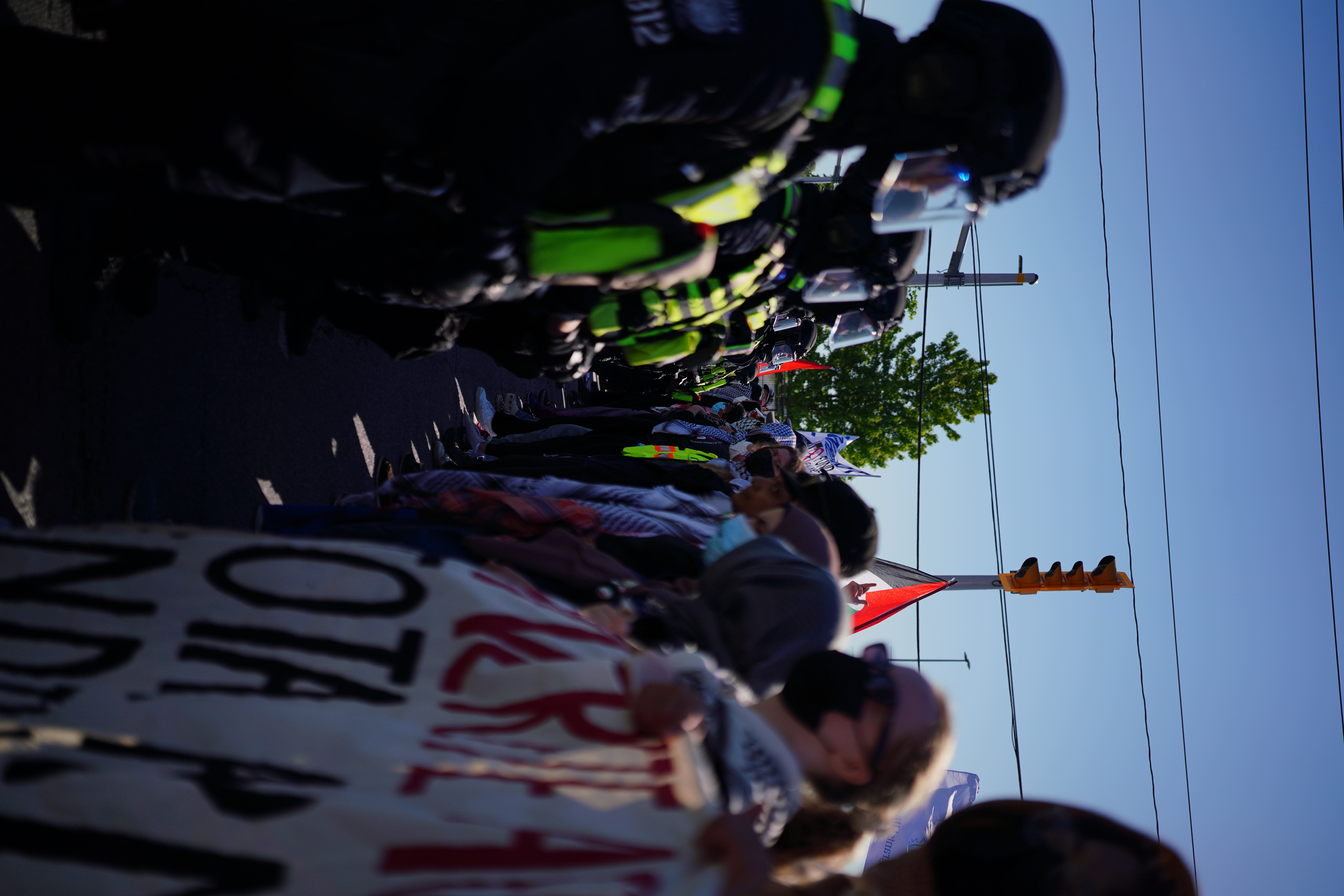 Protesters face off with hundreds of cops in riot gear as police attempt to clear the way for CANSEC attendees to enter.