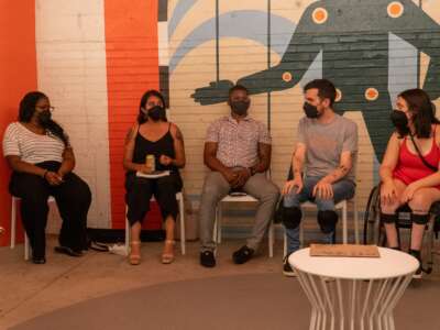 Dom Kelly (second from the right), co-founder, president, and CEO of New Disabled South, participates in a community meeting.