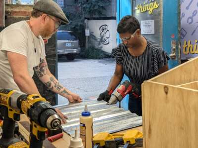 Devon Curtin helps teach a little free library workshop at PVD Things in 2024.